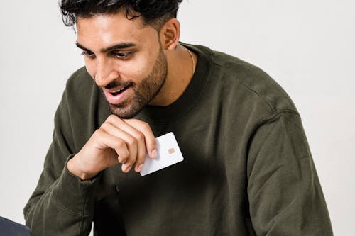 A man using a Cyber Weekend promo code to pay for his online order.