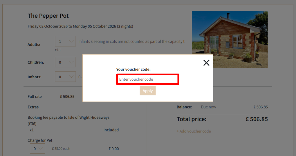 An Isle of Wight Hideaways voucher code box highlighted with a red box on their booking page
