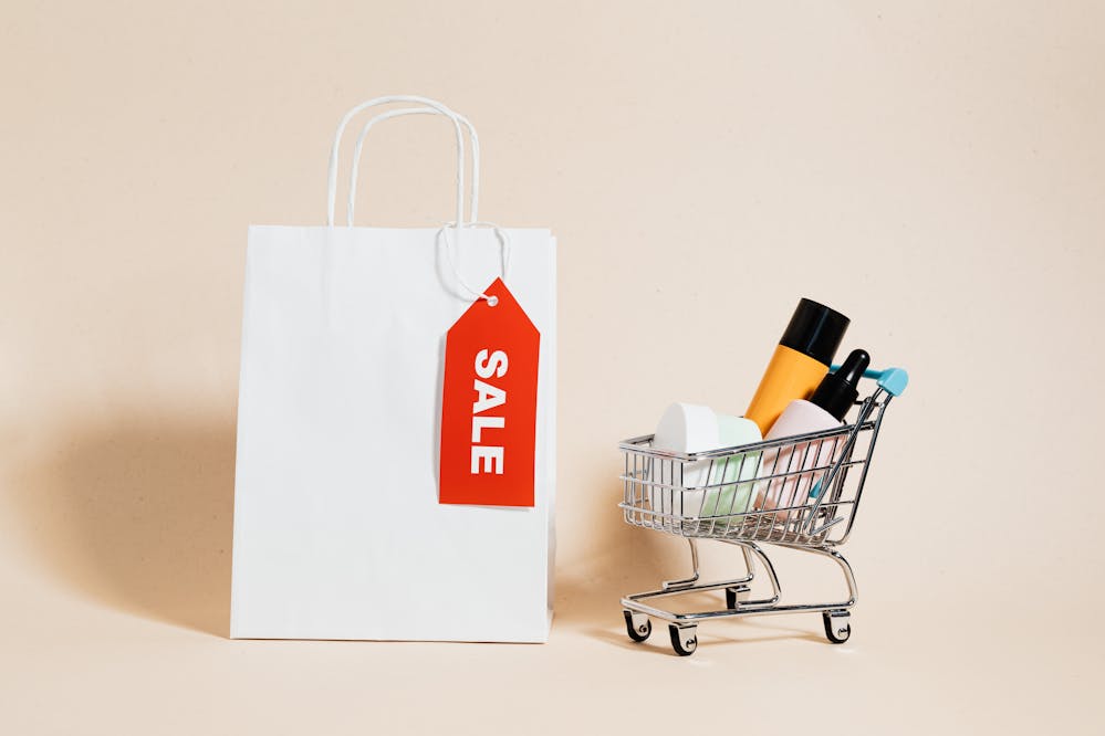 Best Black Friday deals: White bag next to beauty products in a mini shopping cart