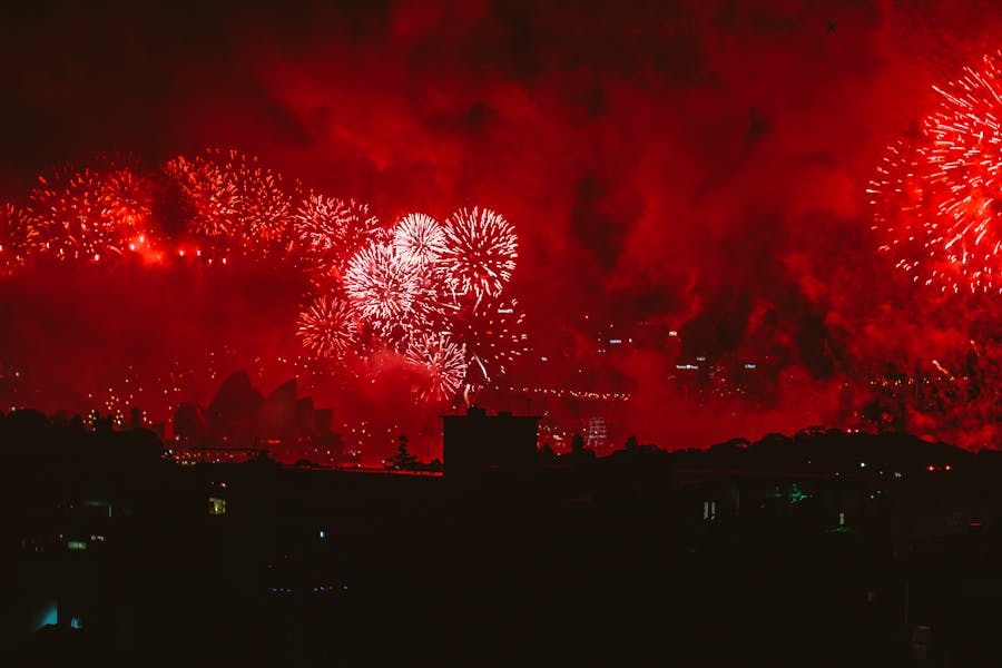 Red fireworks lighting up the night sky in Sydney Australia