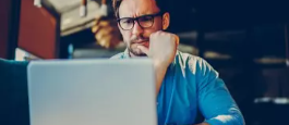A man is looking at the computer