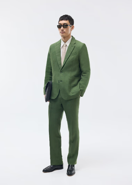 Wedding guest suits: A model wearing a linen blazer and trousers set