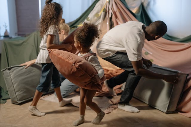 Activities for Father's Day: A father and daughter playing in a self-made fort