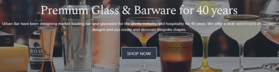 Urban Bar page with a description and how long they have been in this industry for. In the background different glasses can be seen with liquid in it