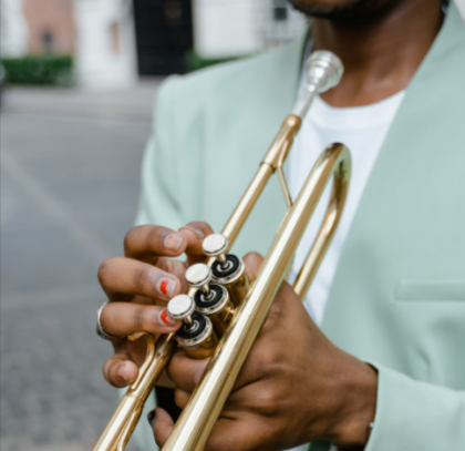 Musician playing a trumpet with Insure4Music equipment cover
