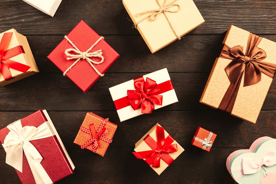 Wrapped gift boxes in red and gold that look like presents