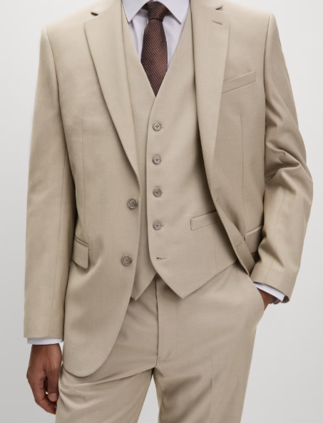 Wedding guest suits: A model wearing a regular-fit three-piece suit