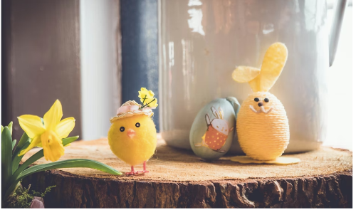 Easter characters placed on a log