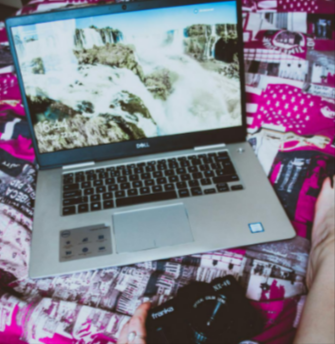 Silver Dell laptop and camera