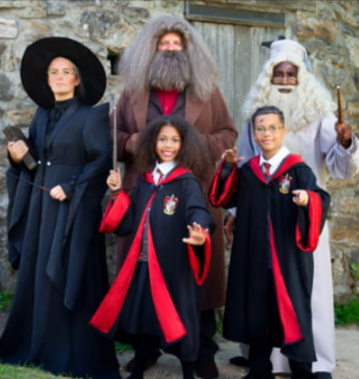 A family wearing costumes bought from the group collection on the Halloween Costumes website