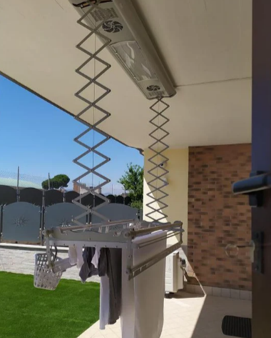 A Foxydry Air mounted to the ceiling on a patio outside