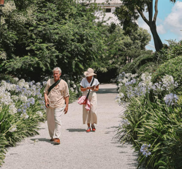 Senior couple strolling in Venetian garden