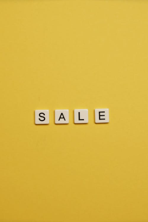 The word "Sale" on a yellow background