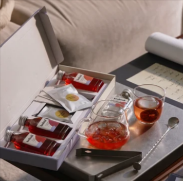 Kocktail congratulations cocktail gifts arranged in a gift box with drinks and glassware