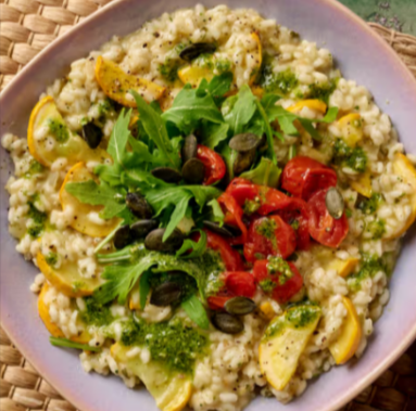A plate of oven-baked roasted tomato and vegan pesto risotto from the {brandz} meal kit.