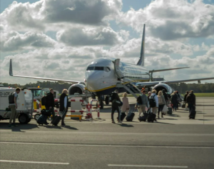 Passengers boarding aeroplane at Wrocław-Airport