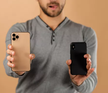 A man comparing two phones