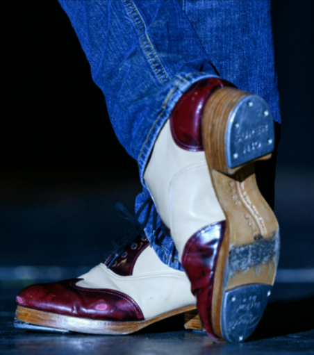 Close up of vintage tap dance shoes in action with Bloch heels