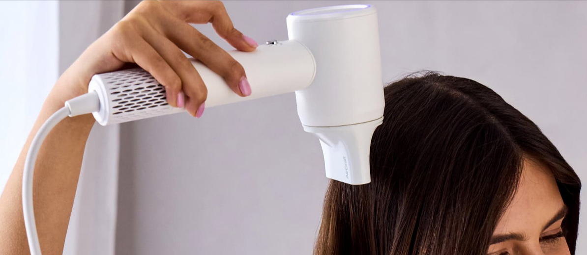 AirCraft airmotion hairdryer being used by a female over her hair