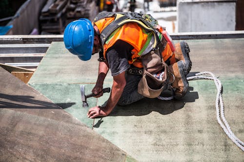 A construction worker working on a project with products from B&Q Tradepoint.